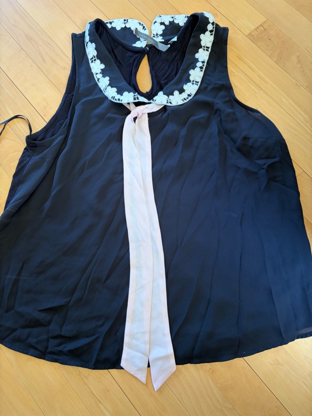 Sleeveless black Top with Lace Collar and Pink Tie